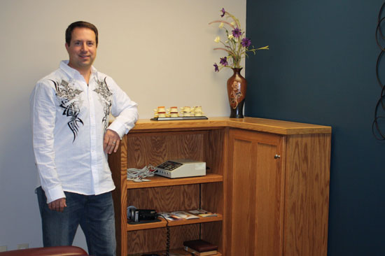 Chiropractor Dr Pete Landry in his office in Elk River MN